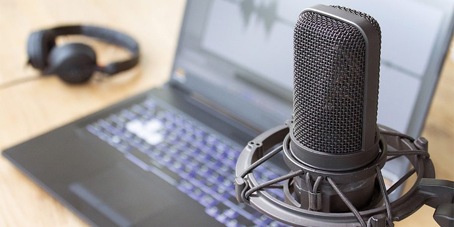 Podcast,Recording,At,Home,With,Laptop,And,Vocal,Microphone